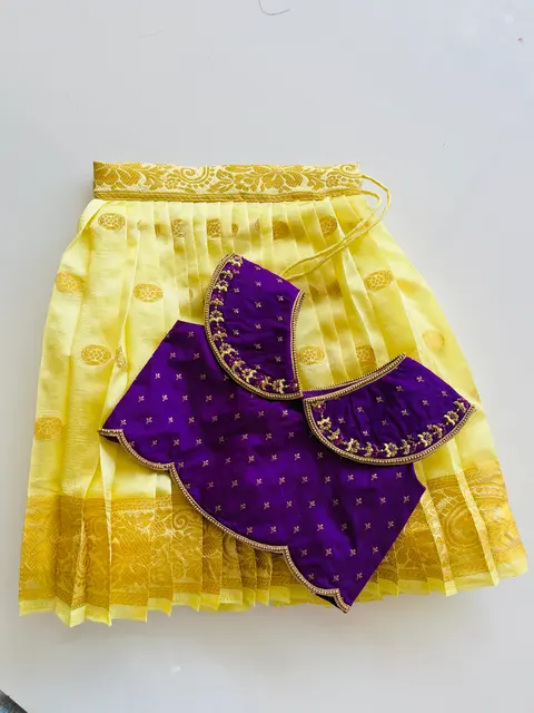 A purple blouse with gold butti and a scalloped embroidered edge, on yellow silk.